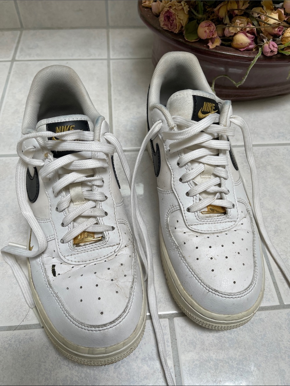 Nike Men’s White Sneakers with Black Swoosh and Gold Accents
